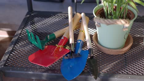 close up of gardening tools on a metal table