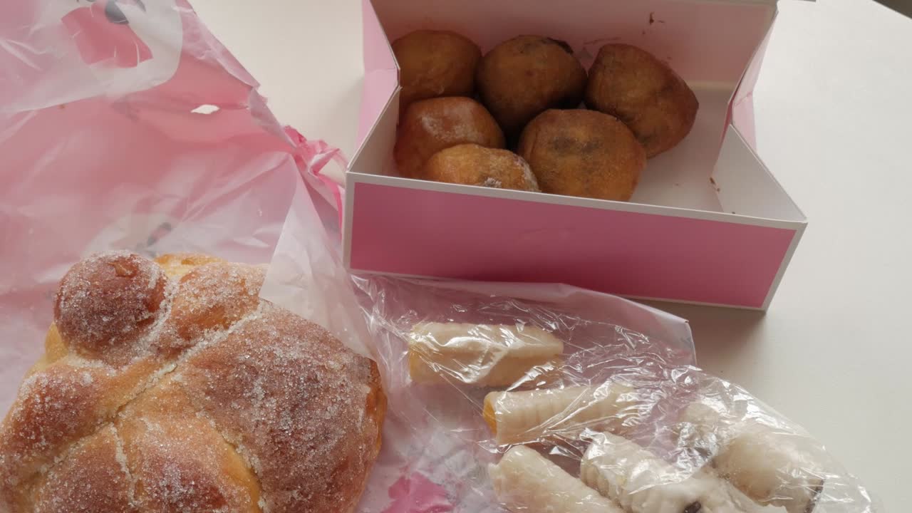 Sweet treats original from Mexico and Spain, Pan de Muerto, Huesos de Santo and Buñuelos.