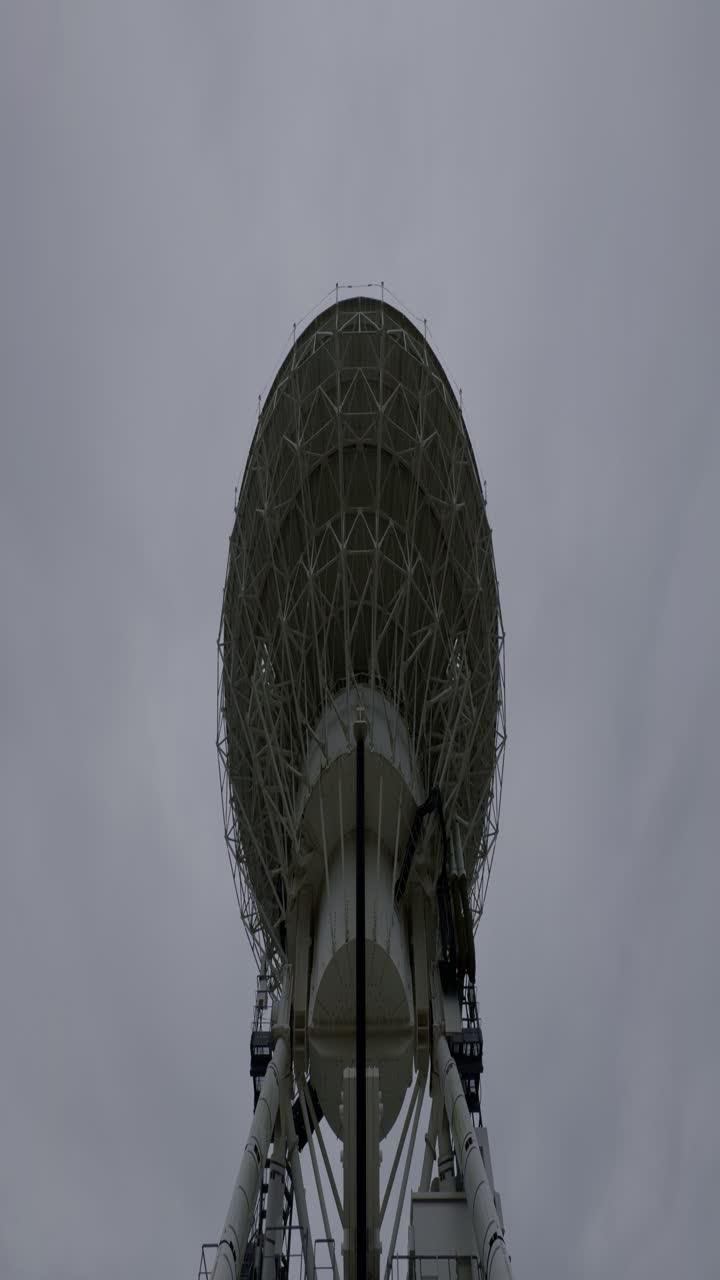 Radio Astronomy in Iwate, Japan Iwate’s radio telescope stands as a marvel of science and technology, framed by cloudy skies and rural Japan