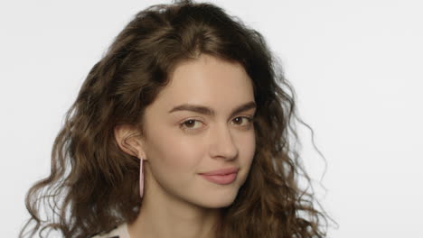 mysterious woman face. close up of joyful woman posing on white background