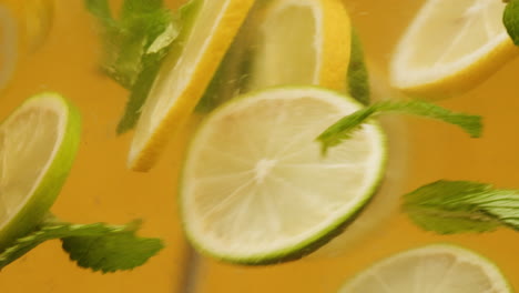 refreshing iced lemonade with lemon, lime, and mint
