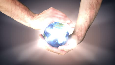 earth spinning in mans hands