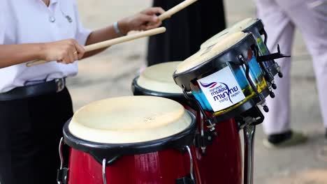 hands playing drums in rhythmic sequence