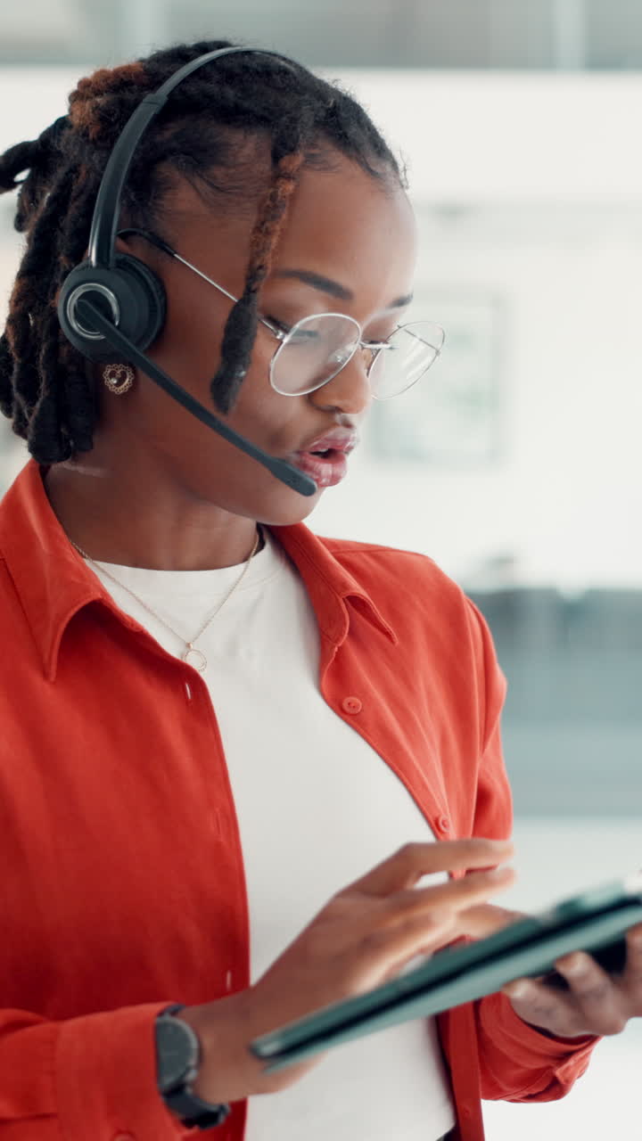 Businesswoman with Headset Using Tablet