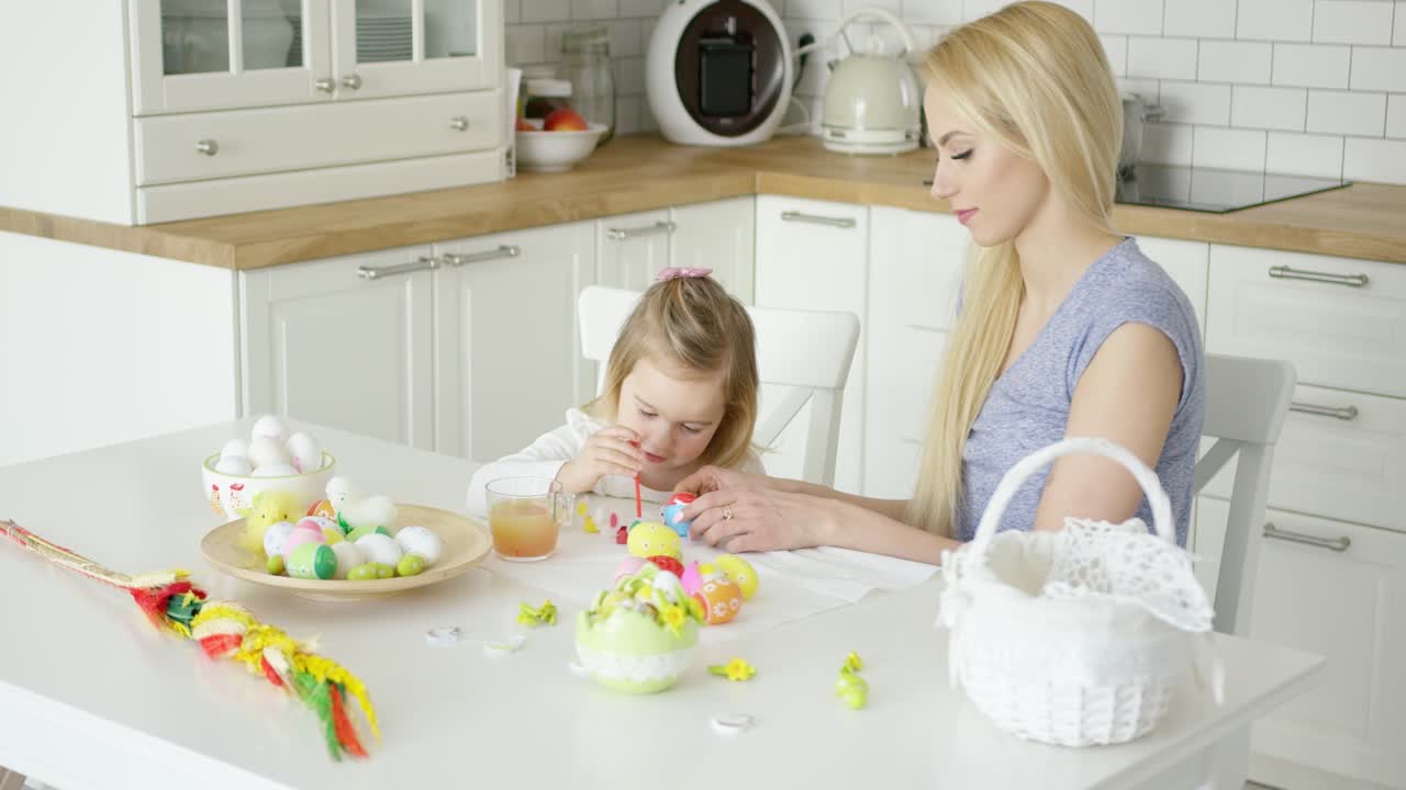Loving family coloring Easter eggs