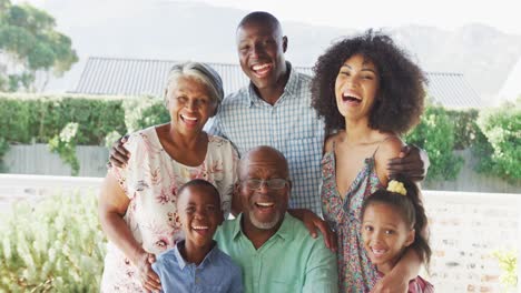 Video-of-happy-african-american-family-spending-time-together-in-the-garden