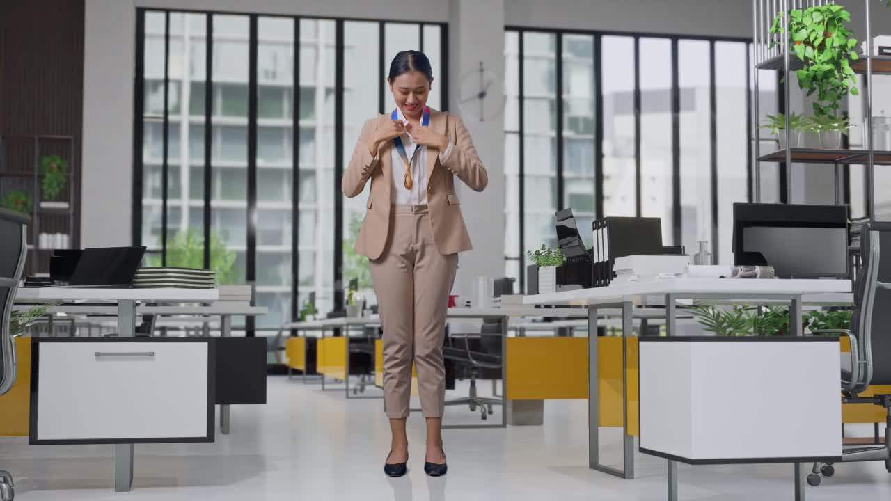 Woman Celebrating Achievement in Modern Office