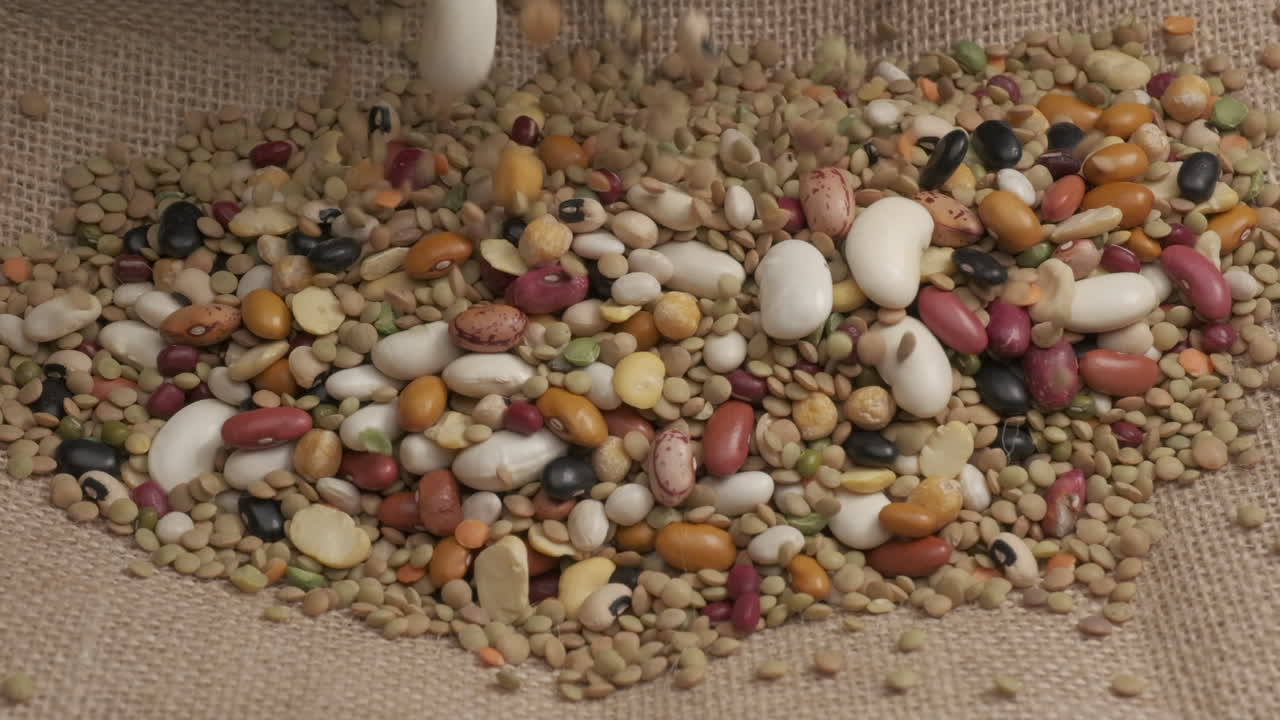 Dry mixed legumes, red white beans, lentils for soup, organic agriculture falling, veggie vegetarian vegan protein source in mediterranean healthy diet nutrition