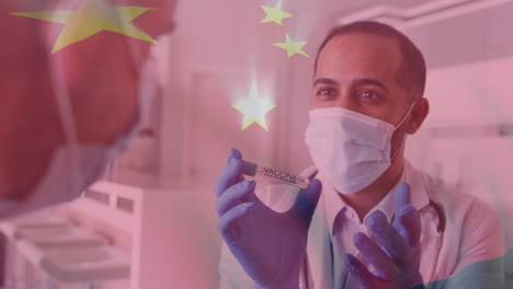 animation of flag of china over male doctor in face mask showing covid vaccine to patient