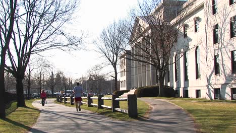 a student jogs through campus