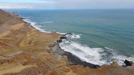 panoramic beach icelandic landscape with a road through sand dunes aerial ocean