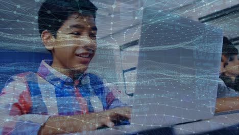 Animation of dots forming wave pattern and programming code over smiling asian boy using laptop