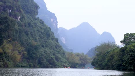 peaceful river scene with lush mountains