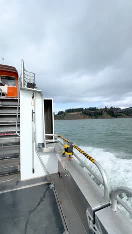 a ferry ride toward yerba buena island with the bay bridge in full view, capturing the scenic beauty of san francisco bay from the water.