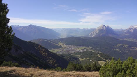 view from the top of seefelderspitze overlooking seefeld in tirol and the mountains of the alps