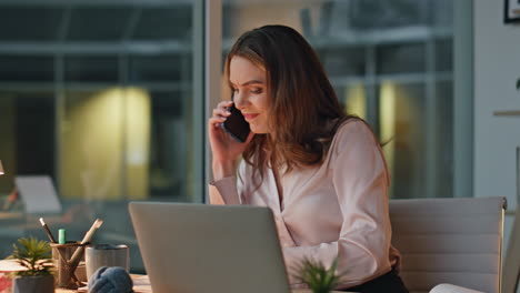 Calling businesswoman solving problem in evening office. employee work