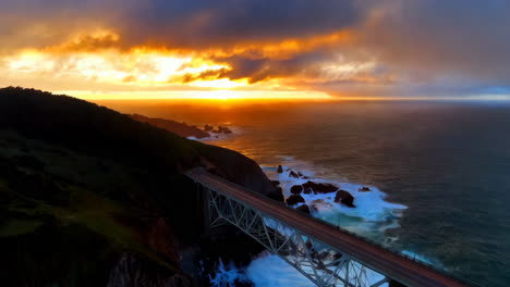 dramatic sunset over a coastal bridge and ocean