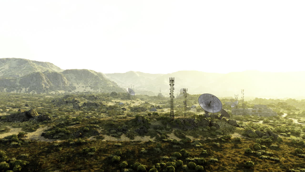 Landscape featuring communication towers and satellite dishes in a desert area