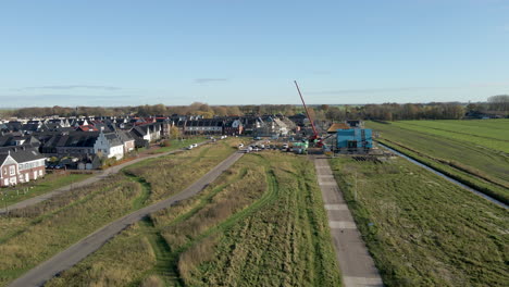 Low-aerial-of-construction-site-in-a-new-suburban-neighborhood