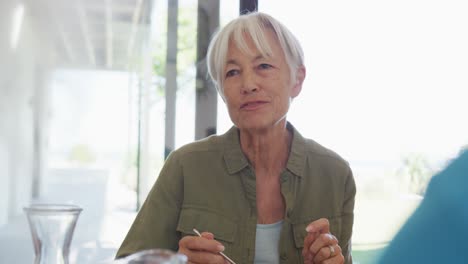 Happy-senior-diverse-people-having-breakfast-at-retirement-home