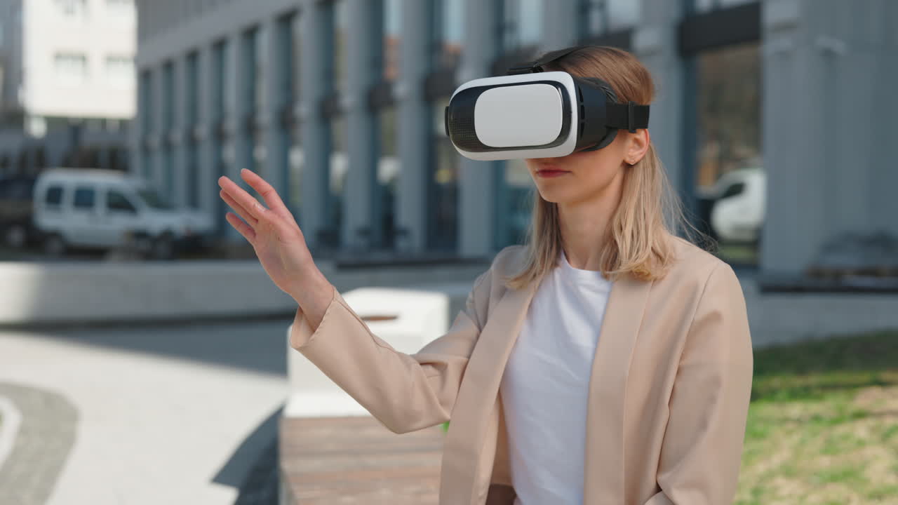 Young Woman Interacting with Virtual Reality Headset Outdoors