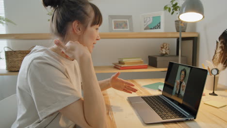 Woman-Speaking-with-Friend-on-Web-Call-at-Home