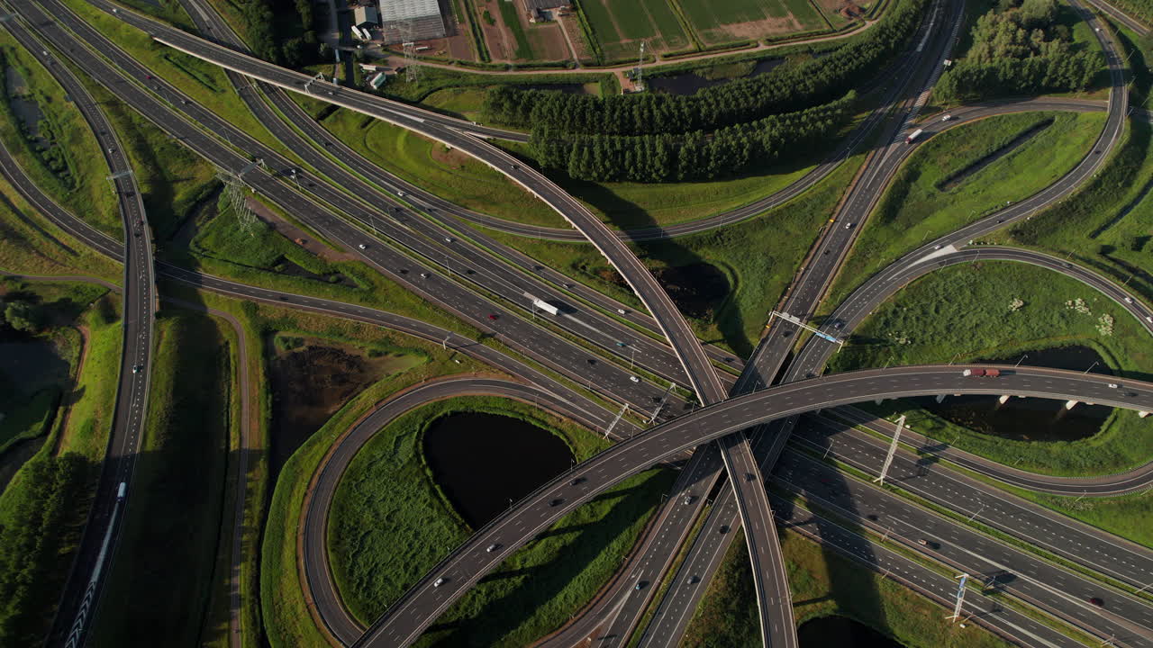 Traffic Over Complex Road Highway Junction Of Ridderkerk In Netherlands. Aerial Drone Shot