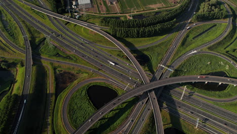 traffic over complex road highway junction of ridderkerk in netherlands. aerial drone shot