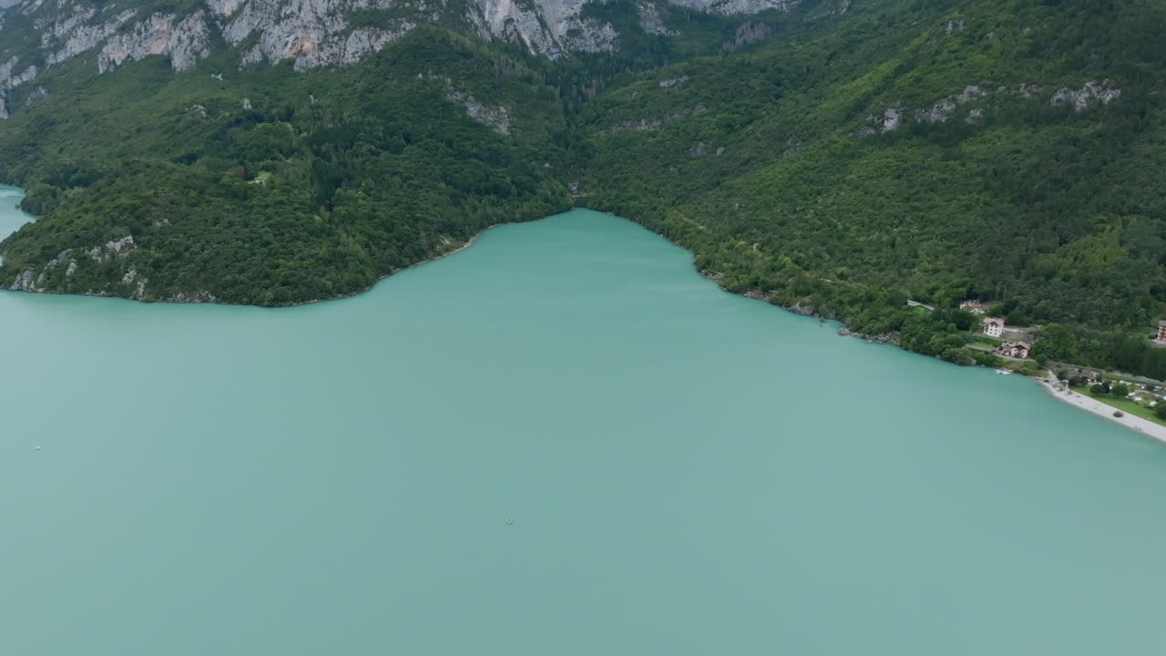 Aerial footage of the lake Molveno in northern Italy with the camera rotating up