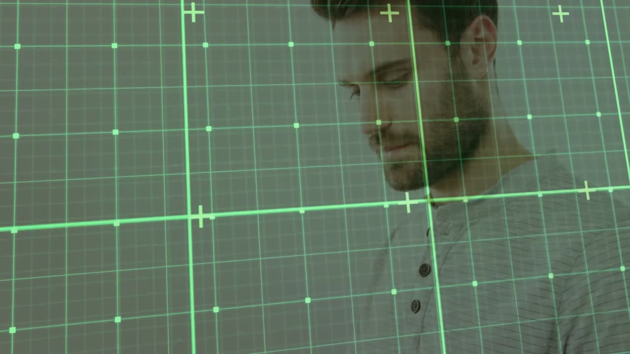 Man tapping and swiping tablet screen, causing translucent green grid overlay for technology demo