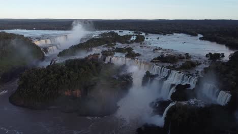 iguazu falls border of argentina and brazil at sunset in amazon rainforest - aerial view