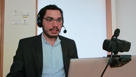 manager leading a video conference from home