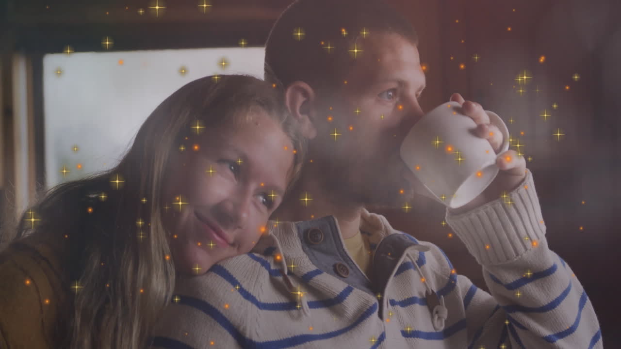 couple leaning near bright window, sipping white mug in health campaign with floating sparkles