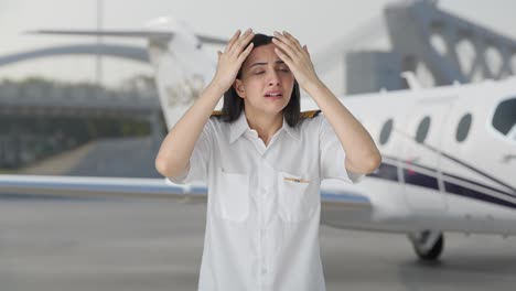 shocked indian woman pilot looking at something