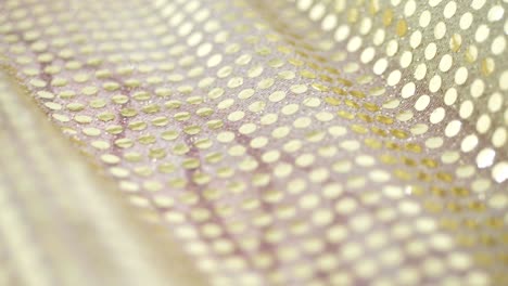 close-up fabric with gold sparkles