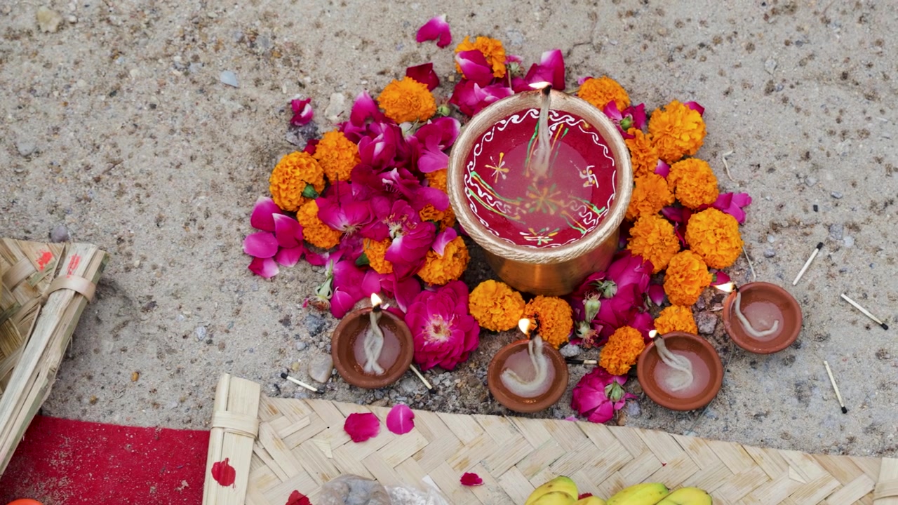 Traditional Diwali Diyas With Marigold Flowers and Rose Petals on Festive Ground Decoration