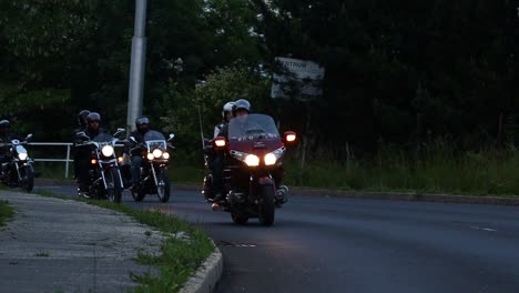 cinematic slow motion rolling shot of motorbike club touring on road, slovakia