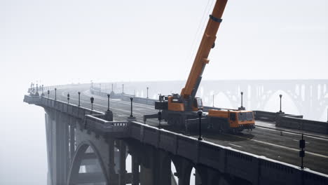 crane on a foggy bridge