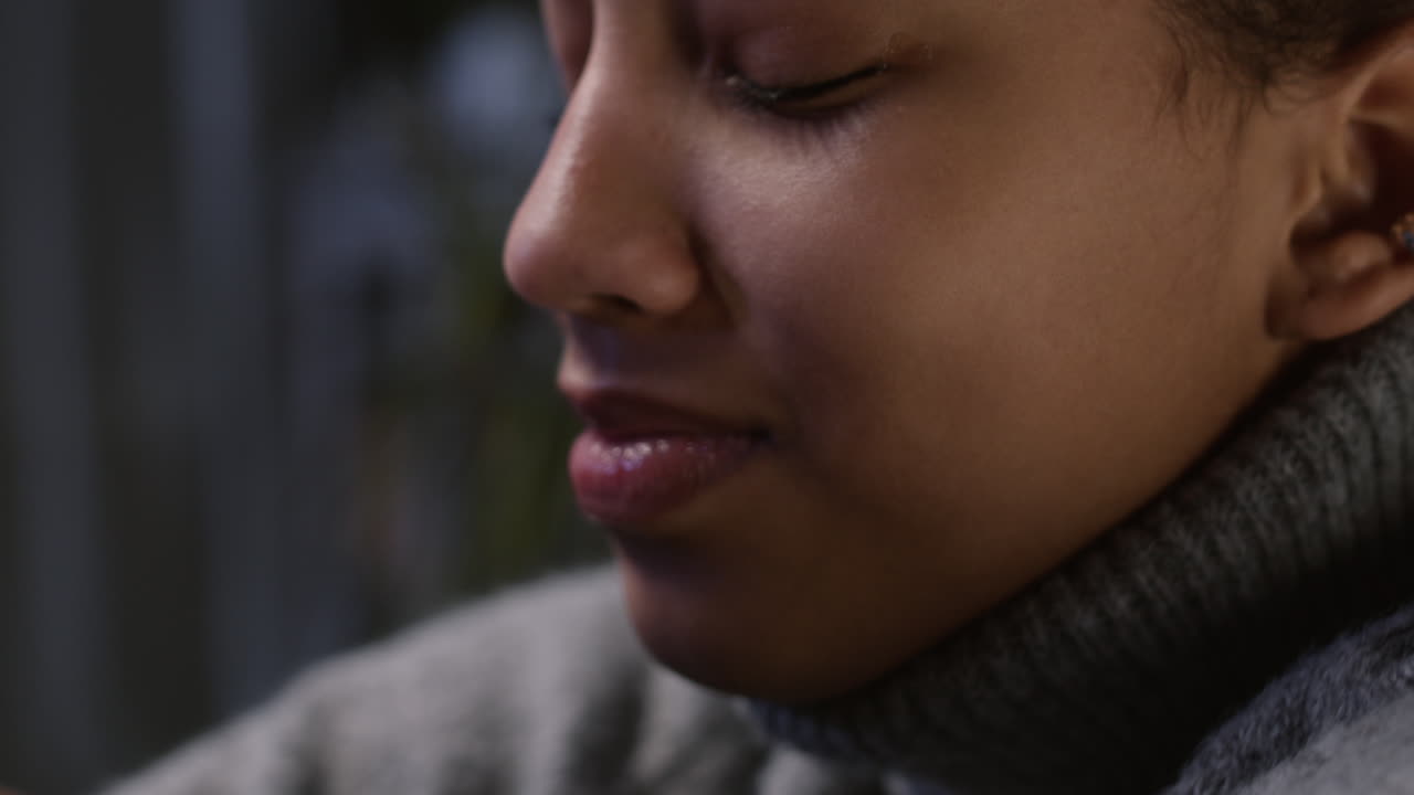 Unhappy girl hugging her knees and laying her head