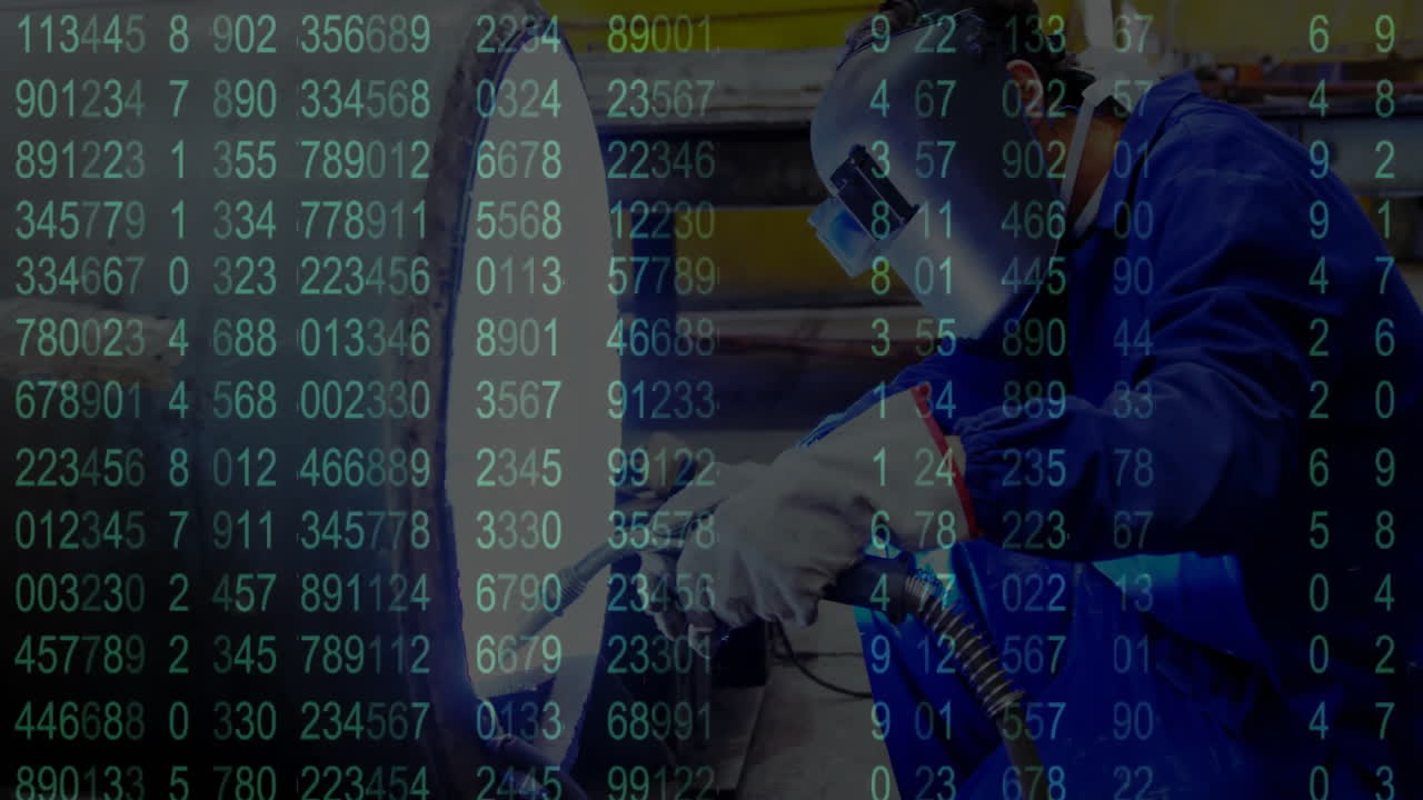 Welder using torch in industrial workshop, with animated green data overlay showing technology