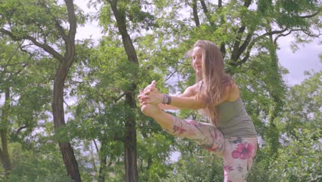 Athletic-young-girl-exercise-wearing-flowery-leggings-in-nature-garden-park,-day