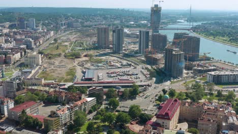 bird's eye view of the highrise buildings of belgrade city beside the danube river in serbia. aerial