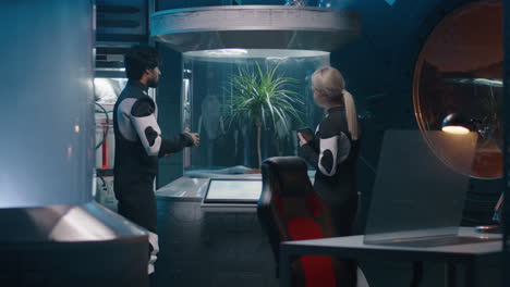 scientists discussing a plant experiment in a futuristic space laboratory