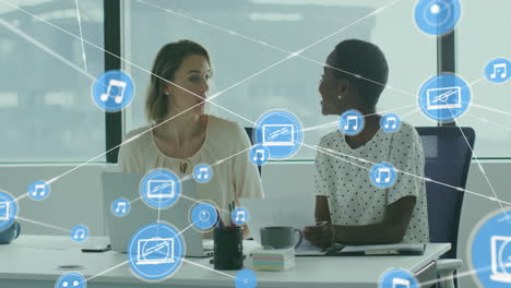 animation of network of connections with devices icons over diverse business people in office