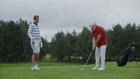 two men playing golf