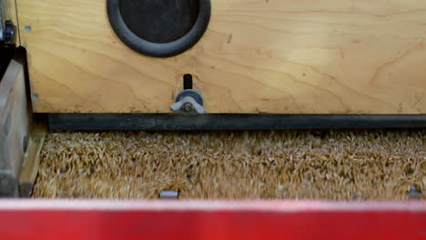 High-angle-view-of-wheat-thresher-machine-in-warehouse-4k