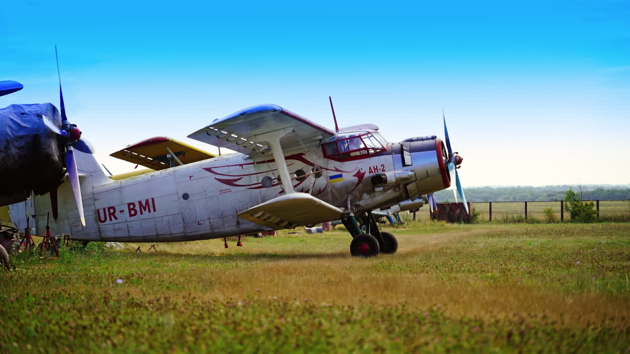 Vintage AN-2 Biplane on a Field