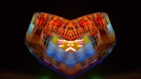 symmetrical carnival ride at night