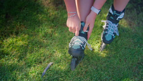 woman adjusting roller skates