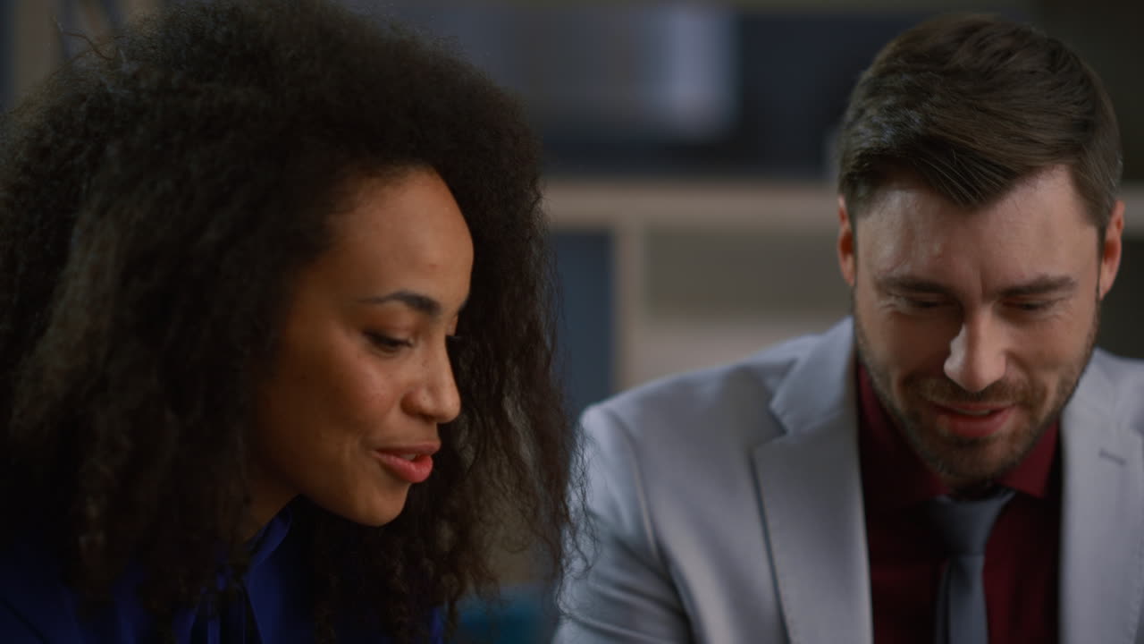 Mixed race colleagues discussing corporate information solve problem in office.